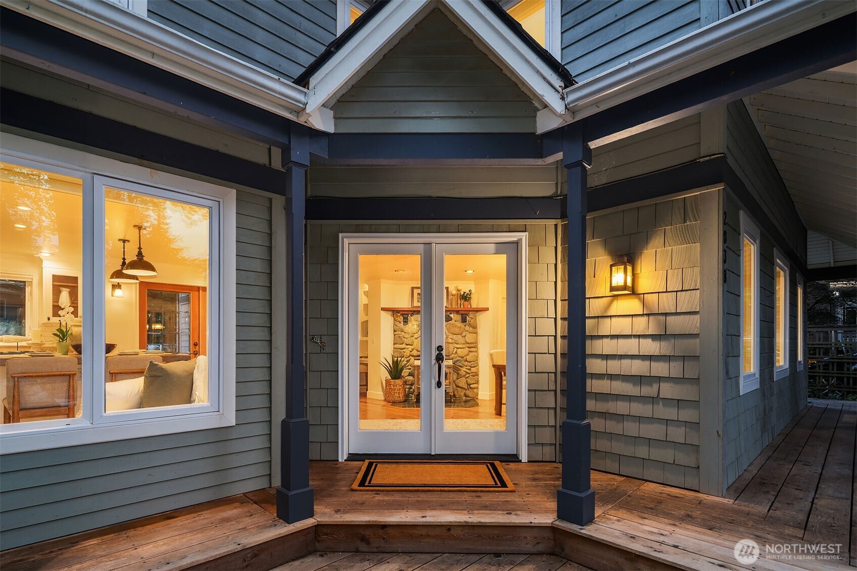 Welcoming front entrance surrouded by storybook gardens and stonework