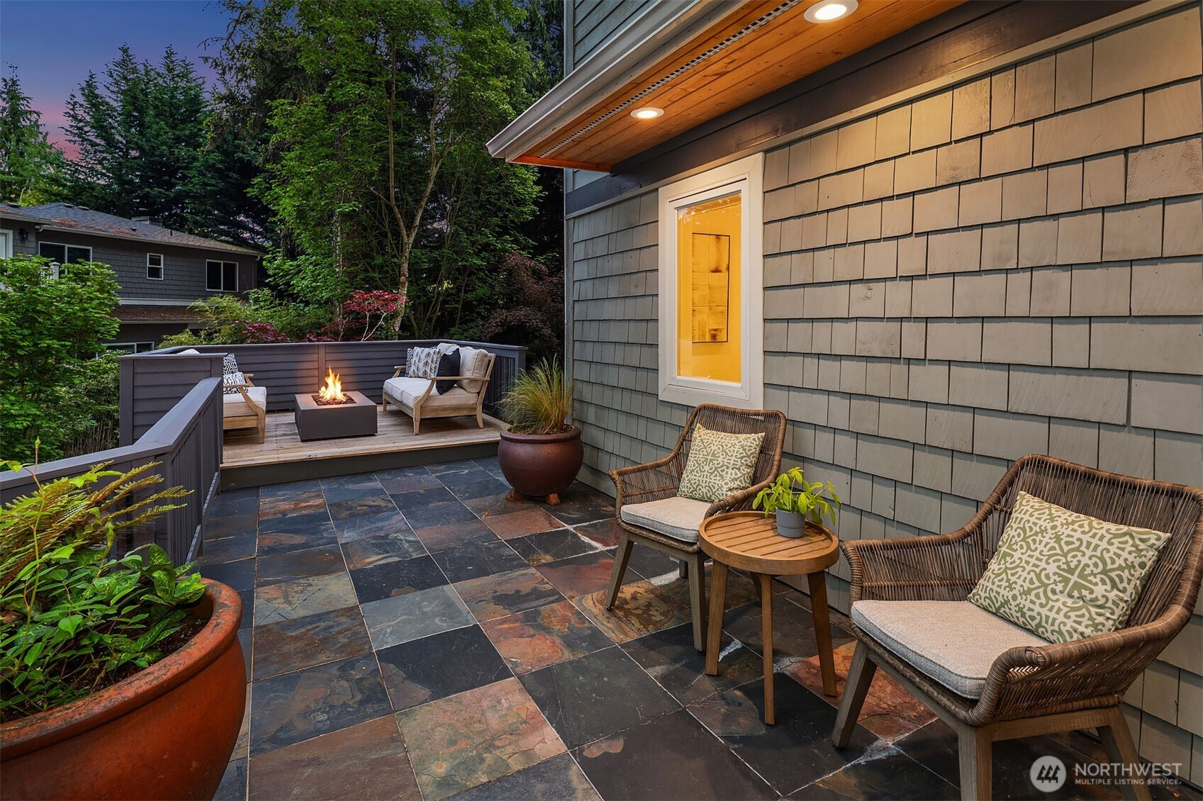 Deck off of kitchen complete with fire pit