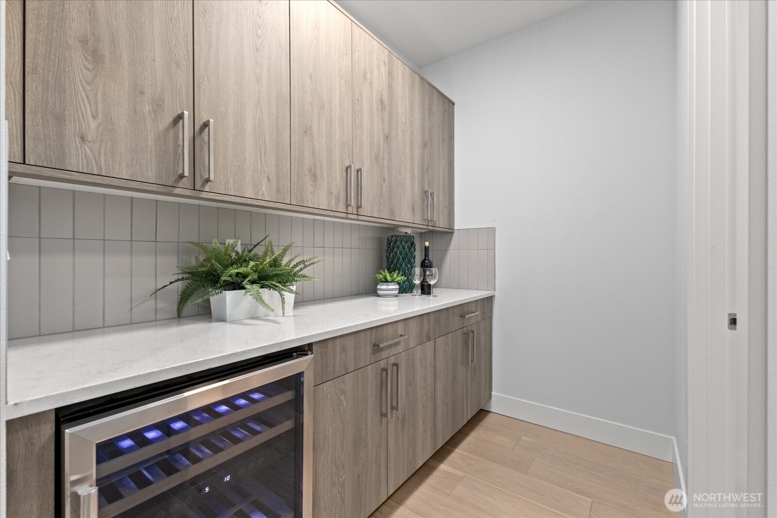 The adjacent prep area with wine chiller adds everyday function and entertaining ease, giving this Kirkland North Rose Hill chef’s kitchen extra storage, serving space, and a polished luxury feel.