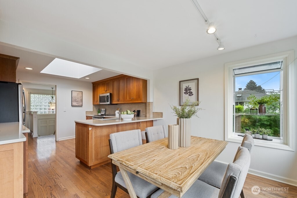 Kitchen nook area sports a garden window for fresh plants and decor!