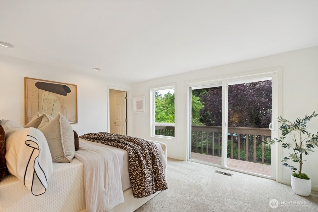 King-sized primary retreat with a private deck access.