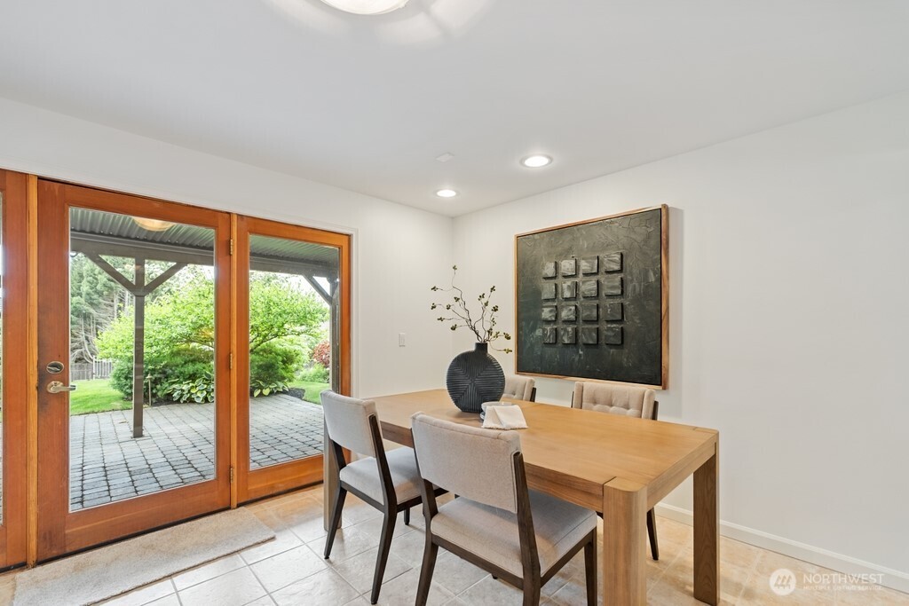 Informal eating area on lower level with outdoor backyard access