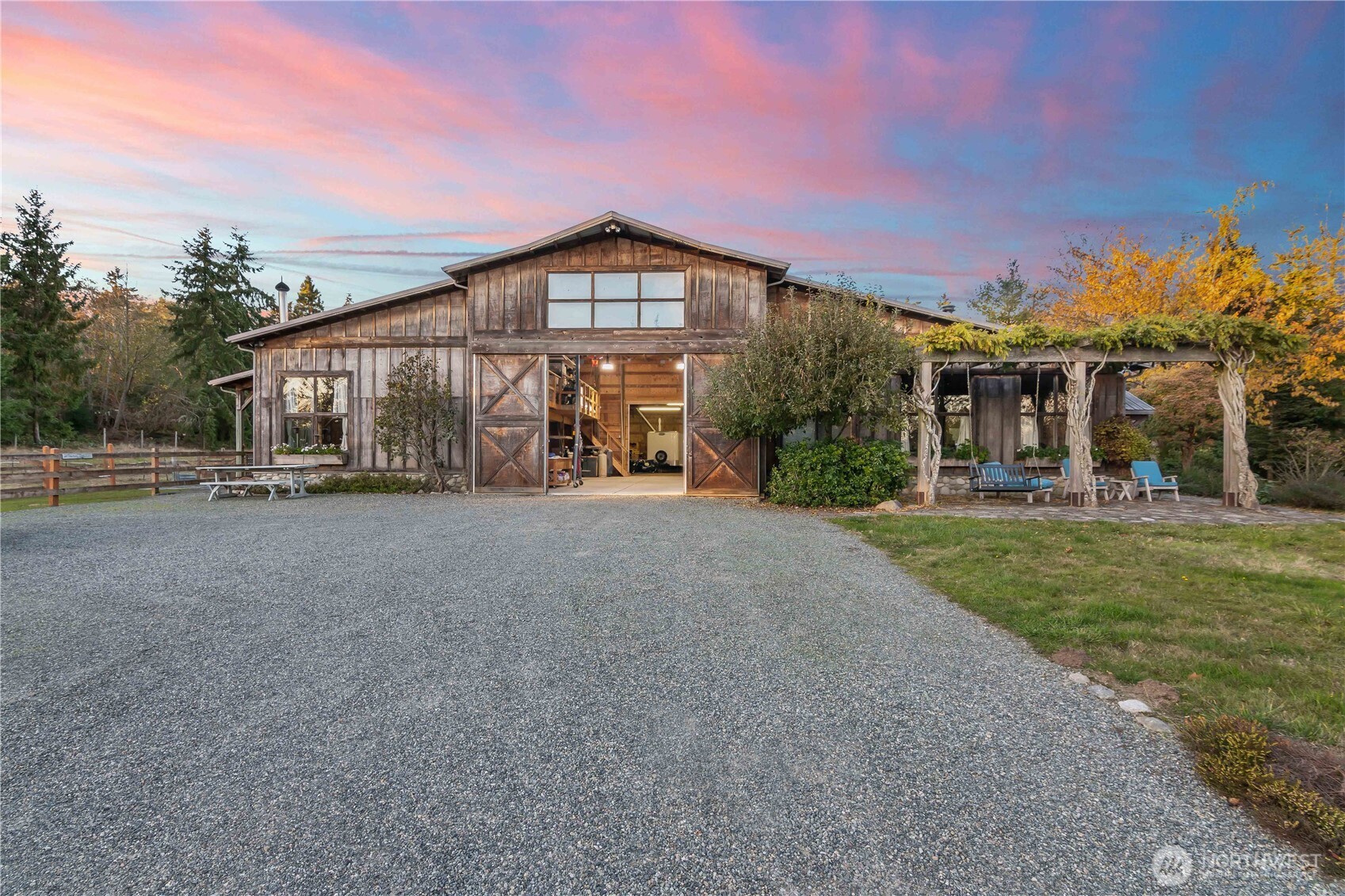 5000 square foot barn includes walk in stalls, elevated hay storage, tack room.