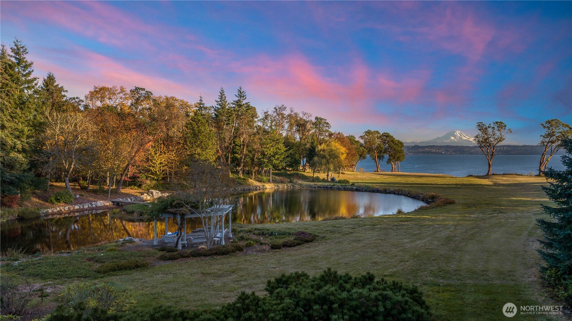 Natural pond with island,  dock and gazebo