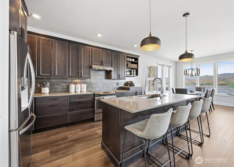 Designed for entertaining and everyday living, this modern Lake Chelan area home offers seamless flow between the kitchen, dining, and great room spaces with beautiful natural light and mountain views.
