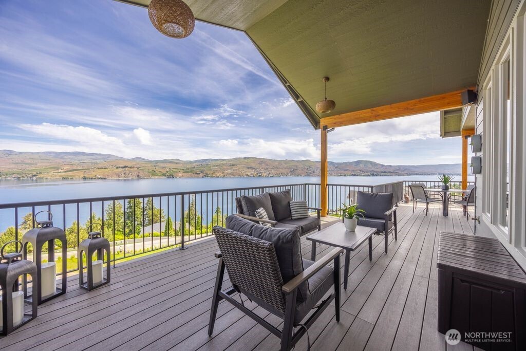 Expansive covered view deck with outdoor speakers and BBQ hookup creates the perfect setting for effortless Lake Chelan entertaining and year-round outdoor living. Ideally positioned on the South Shore, this shaded outdoor space enjoys protection from the intense afternoon sun, allowing for comfortable summer afternoons enjoying the nearly 200 degree view of Lake Chelan