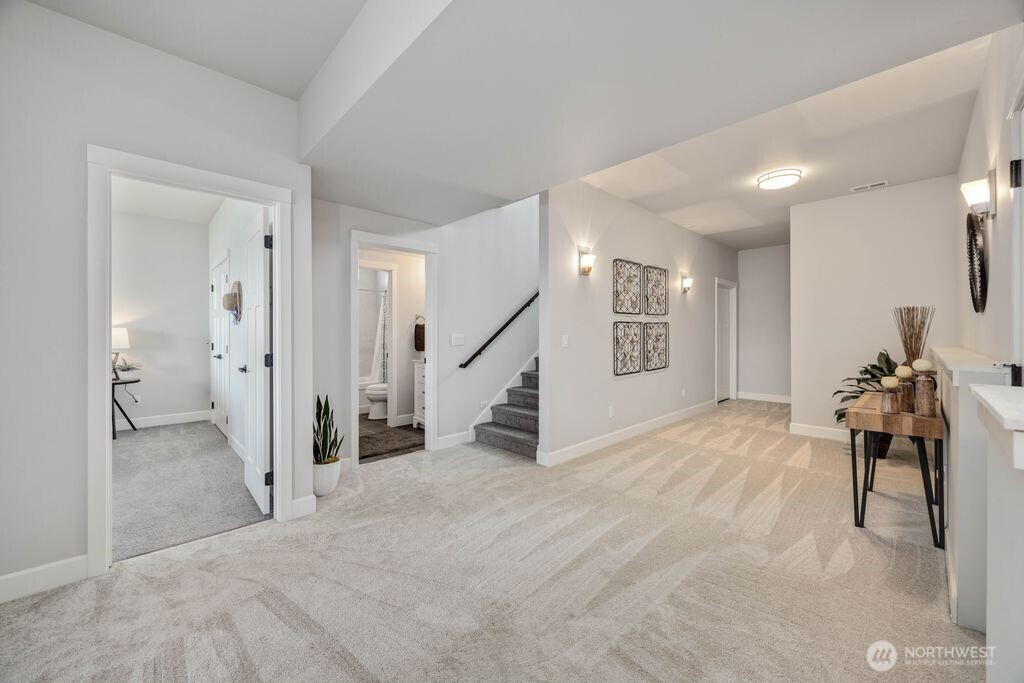The lower level is thoughtfully designed to feel like a natural extension of the main living spaces, offering comfortable separation without feeling disconnected. Ideal for guests, hobbies, or multi-generational flexibility, this level complements the ease of primarily single-level living on the main floor.