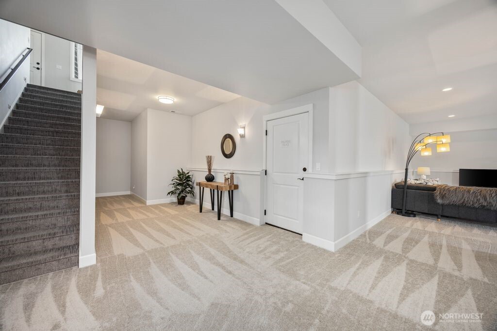 Exceptional storage solutions throughout the home include a spacious dedicated storage room off the lower hallway with a convenient second washer and dryer hookup.