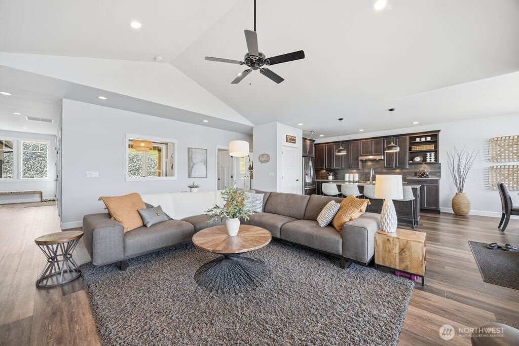 To the left you can see the welcome entry. Interior architectural opening on the far wall creates connectivity and natural light flow between the great room and adjoining flex/game room
