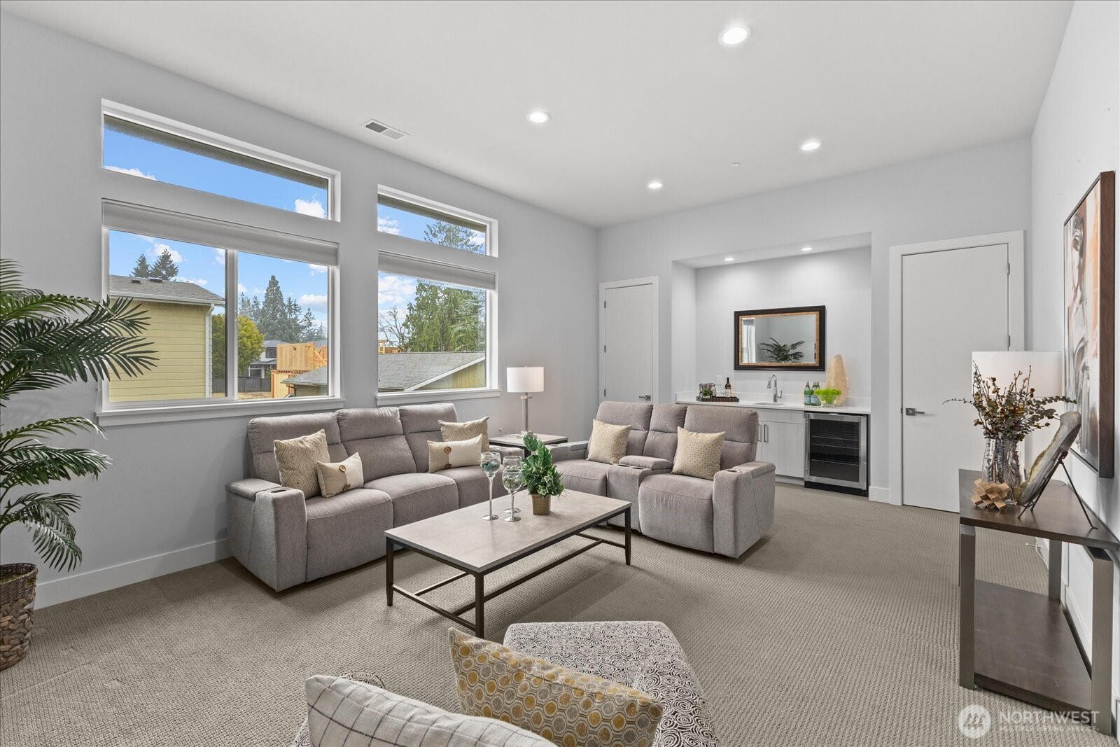 The upper-level bonus room is designed for flexible living with a built-in wet bar sink, wine cooler, and spacious lounge area — ideal for movie nights, entertaining, work, play, or relaxing in this Kirkland North Rose Hill luxury home.