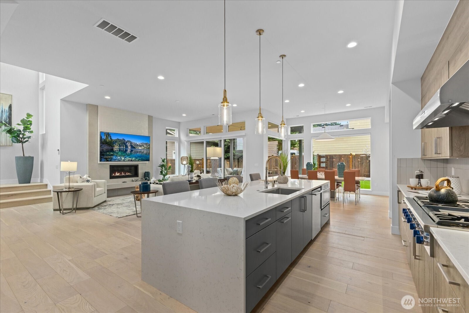 Designed as the true heart of the home, the open-concept chef’s kitchen connects seamlessly to the great room and dining area, creating the perfect layout for everyday living, hosting, and entertaining in this Kirkland North Rose Hill luxury home.