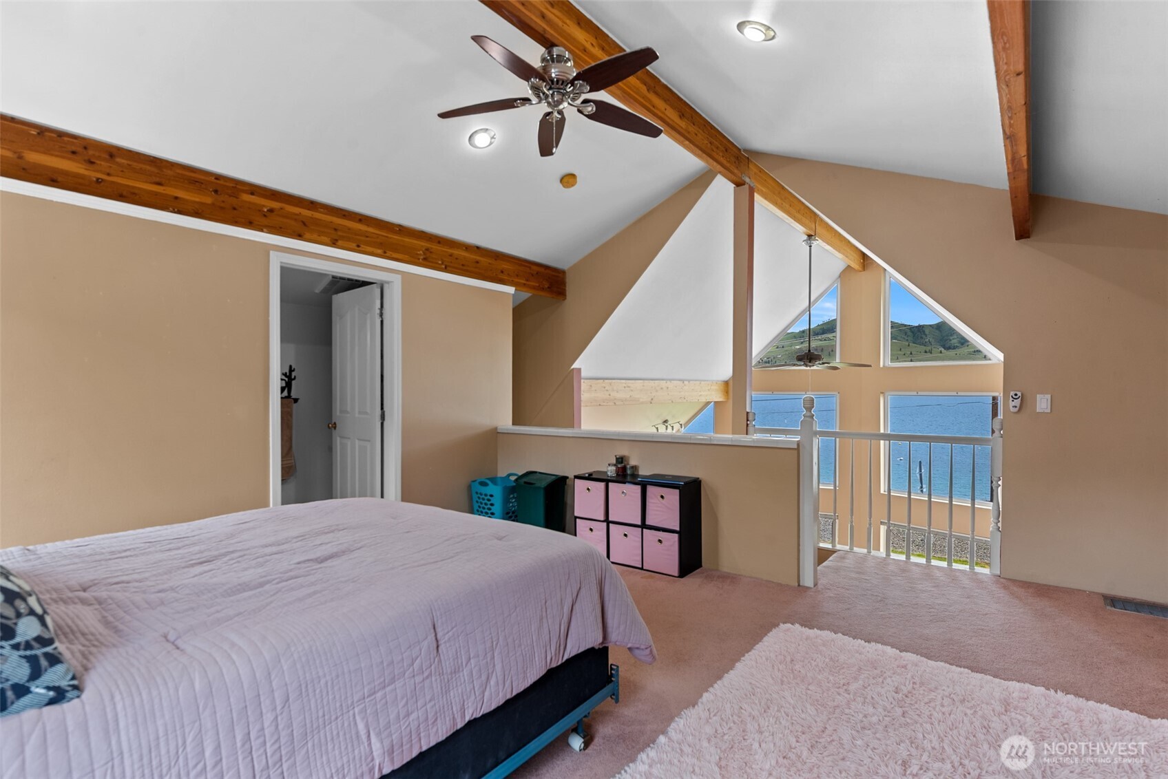 Lake Chelan and mountain views get even better from the upper level guest bedroom suite