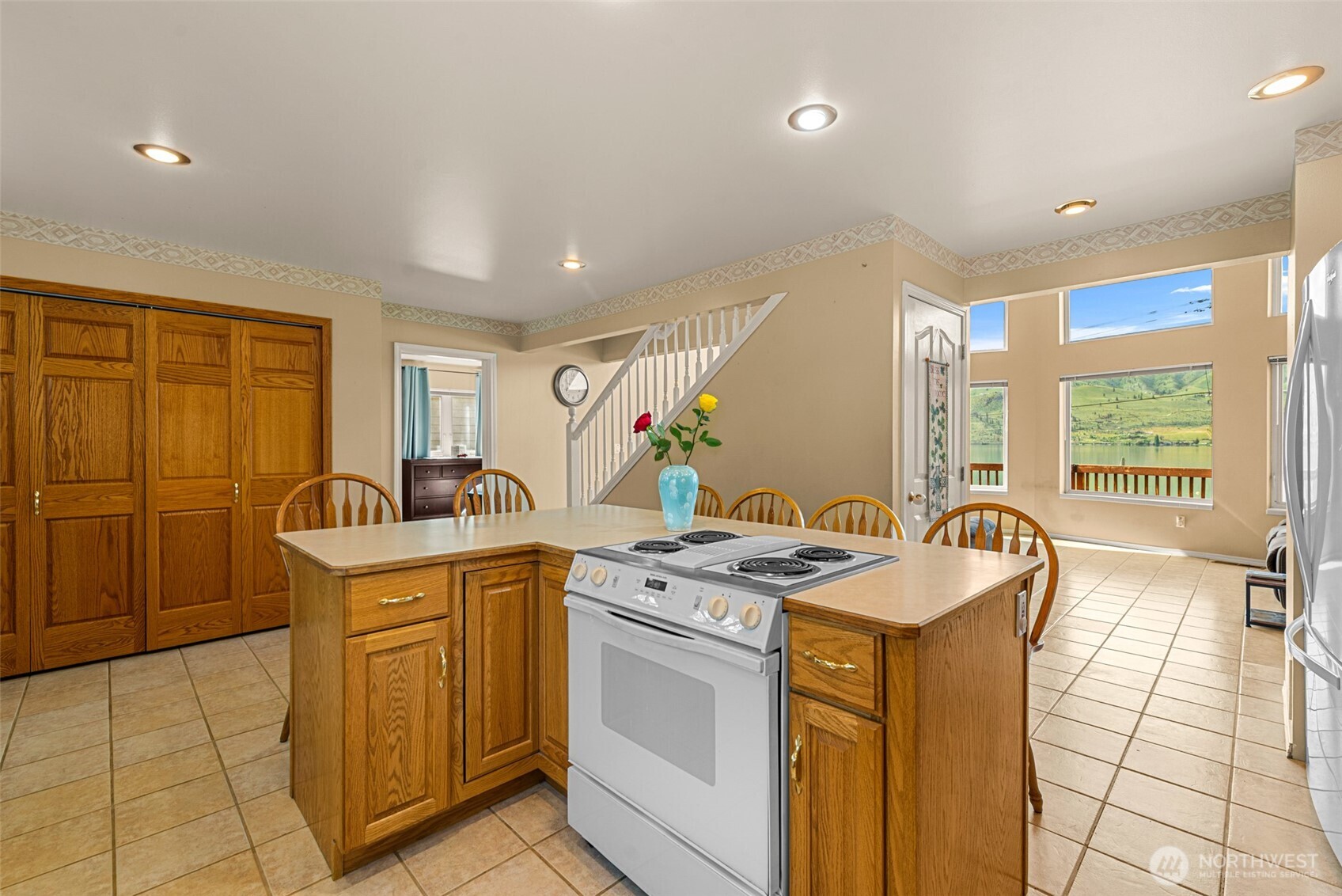 The kitchen has open sightlines to the great room and beautiful Lake Chelan views beyond.