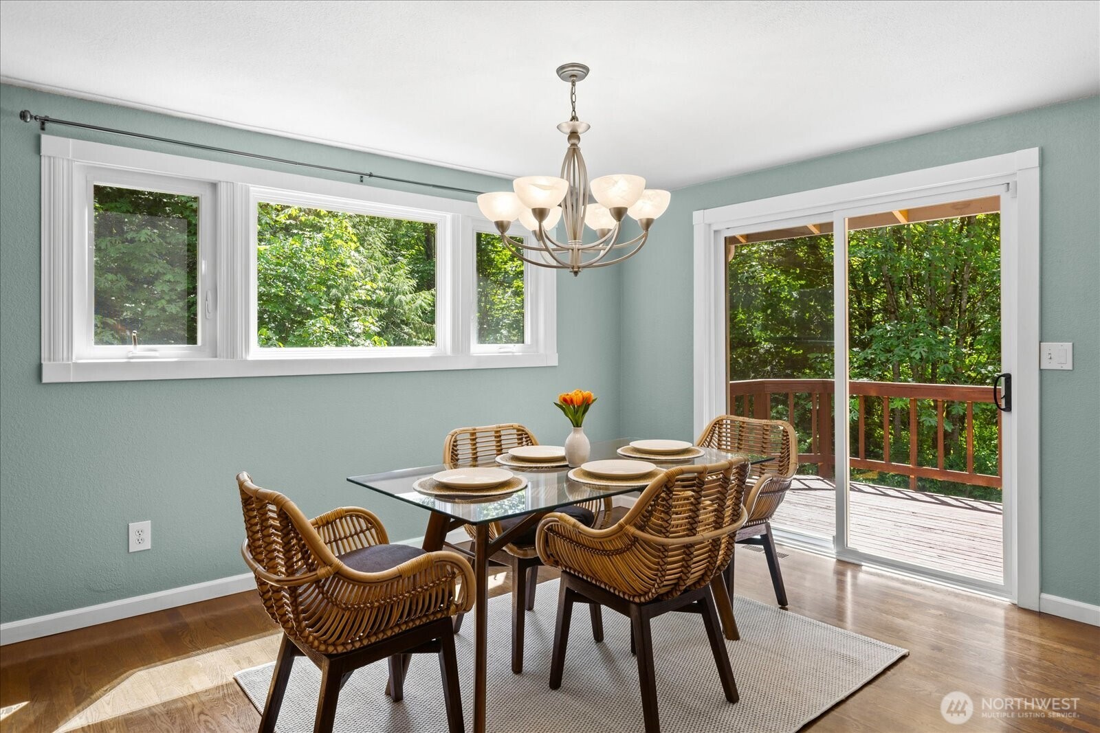 Adjoining dining room with doors to the deck.