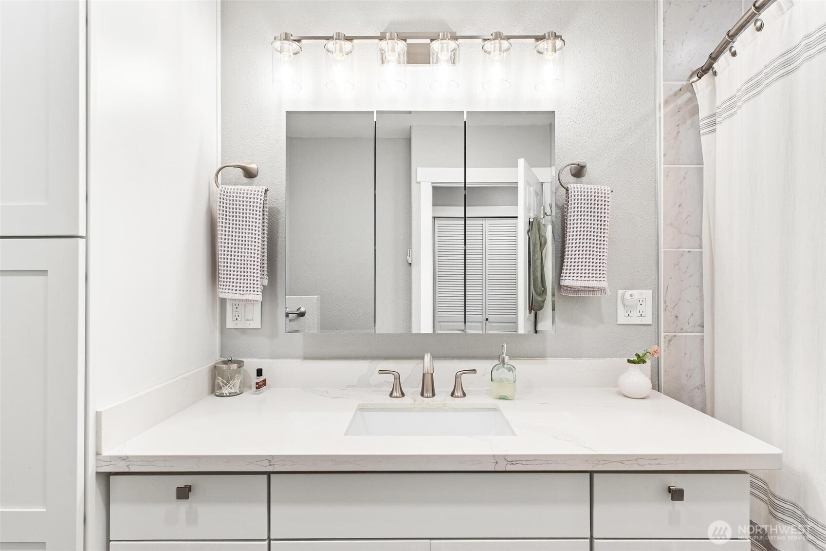Convenient laundry room with added storage.