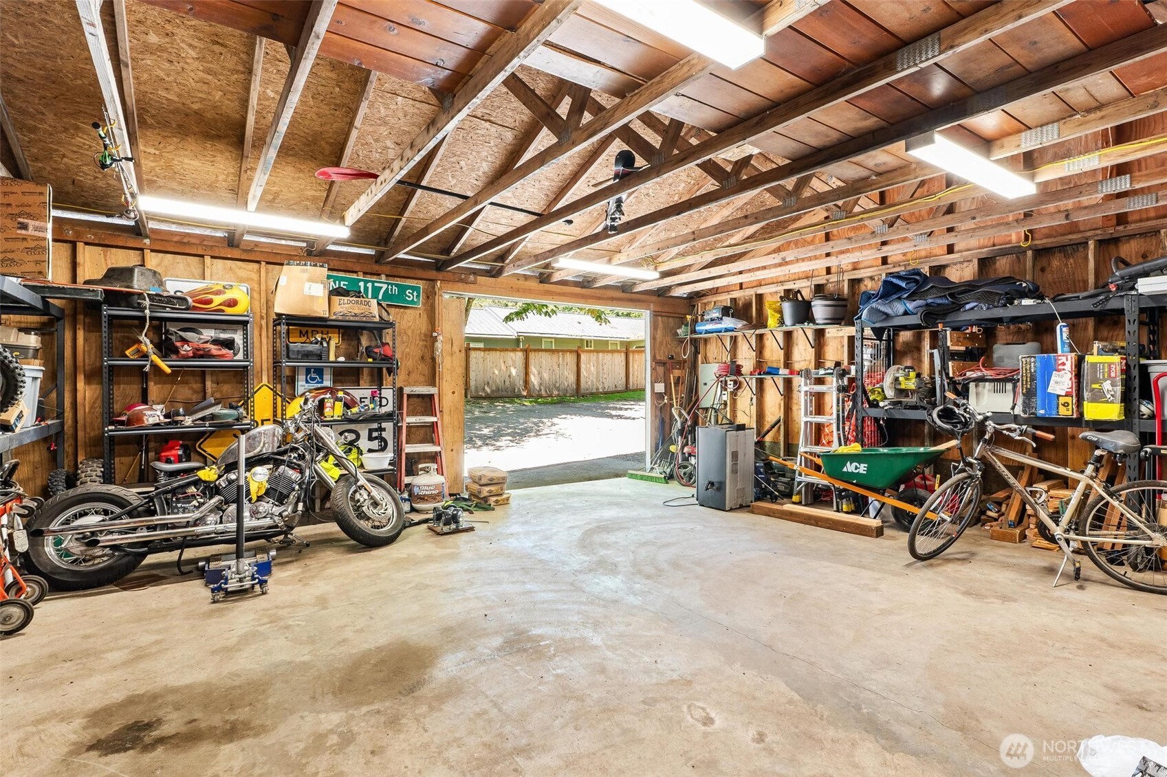 Detached one-car shop garage perfect for hobbies or storage.