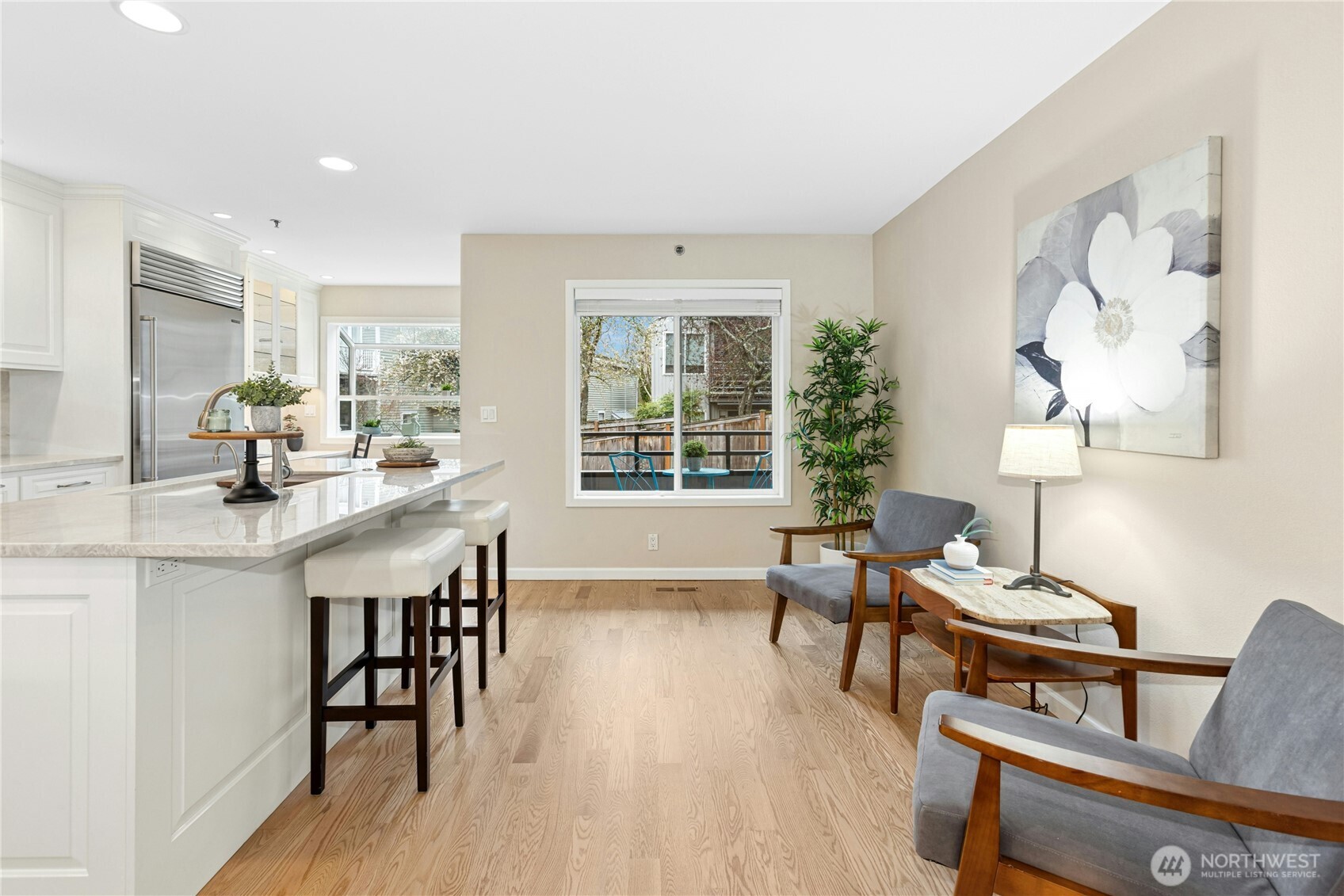 The dining room has a new light fixture and a convenient pass-through to the kitchen.