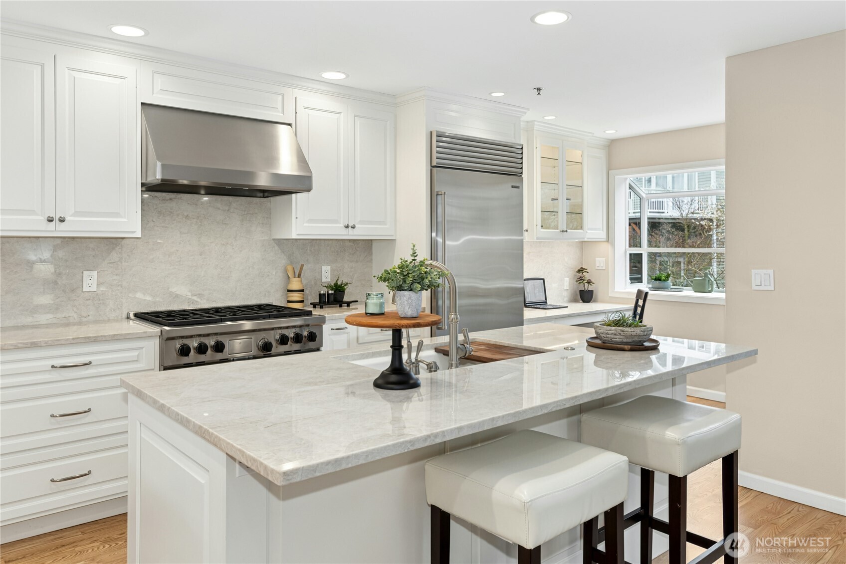 The spacious island kitchen has been totally remodeled and offers a breakfast bar.