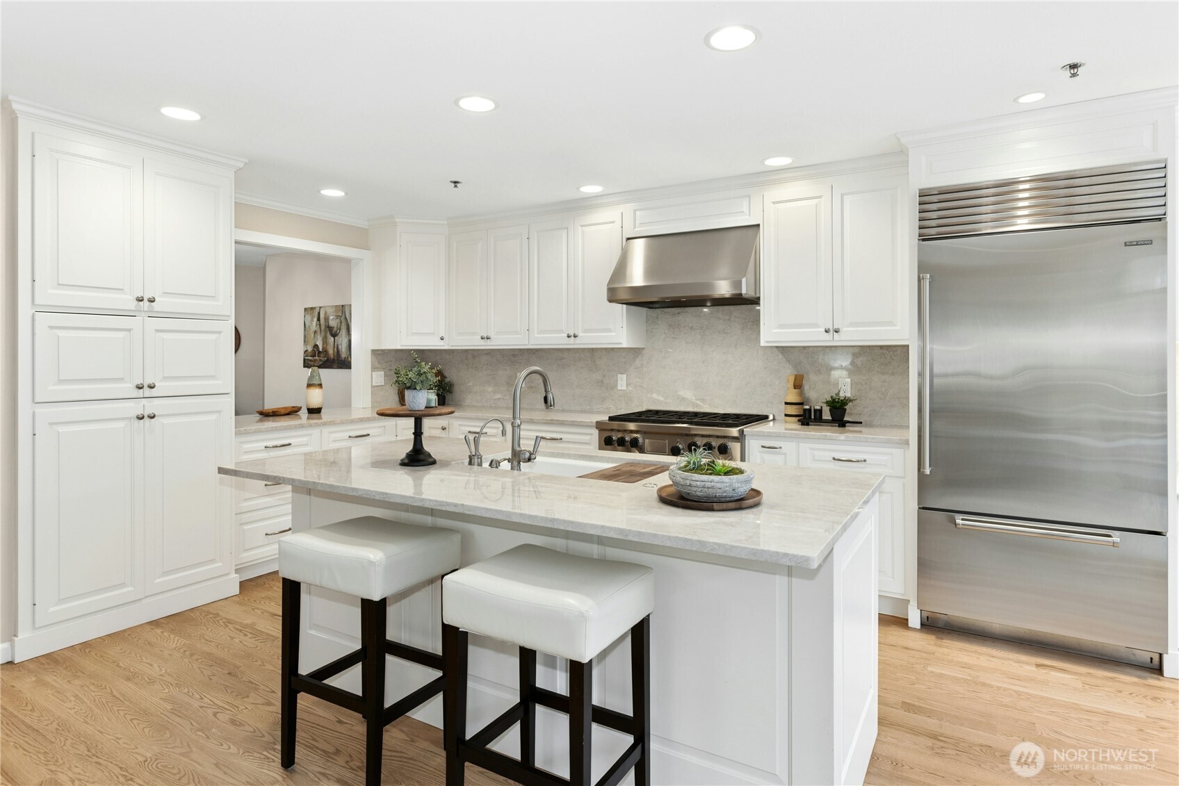 You will love the beautiful selections here: quartzite counters, all high-end stainless appliances, including a Wolf 6-burner gas range, Sub-Zero refrigerator, and plenty of soft-close cabinets and drawer space!