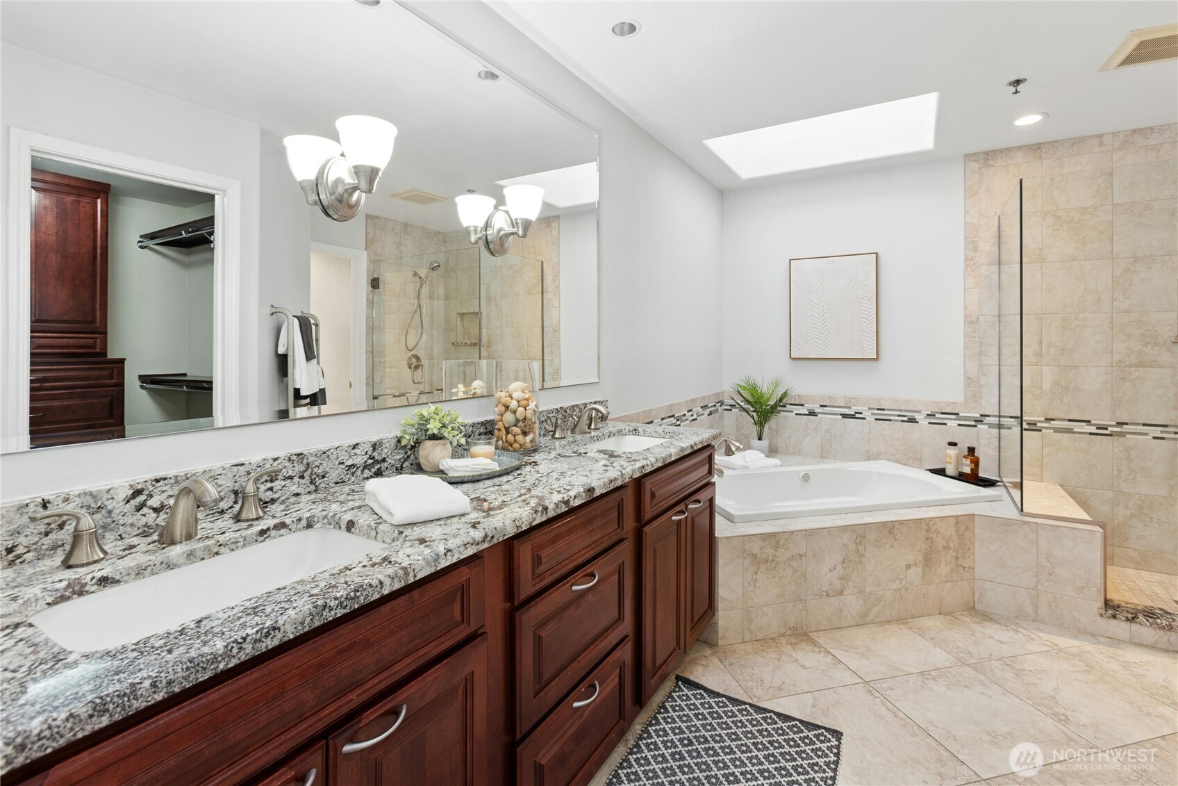 The primary suite is adjacent to the 5-piece bath and has 2 closets: one large reach-in closet and one large walk-in closet.