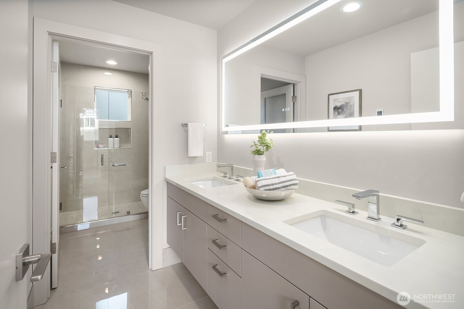 Guest bathroom with heated floors and European wall-mounted toilet