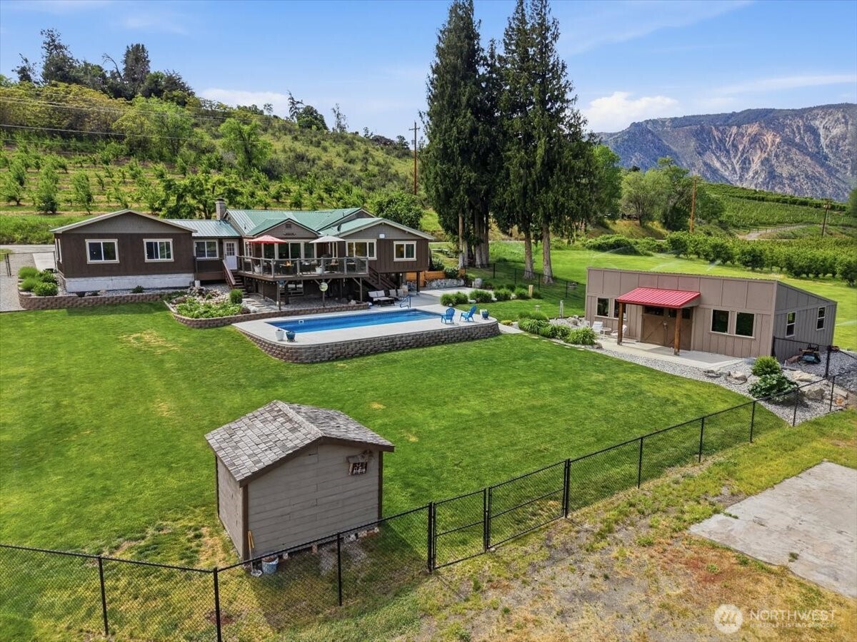 Drone photo of exterior setting and 1/2 an acre fully fenced