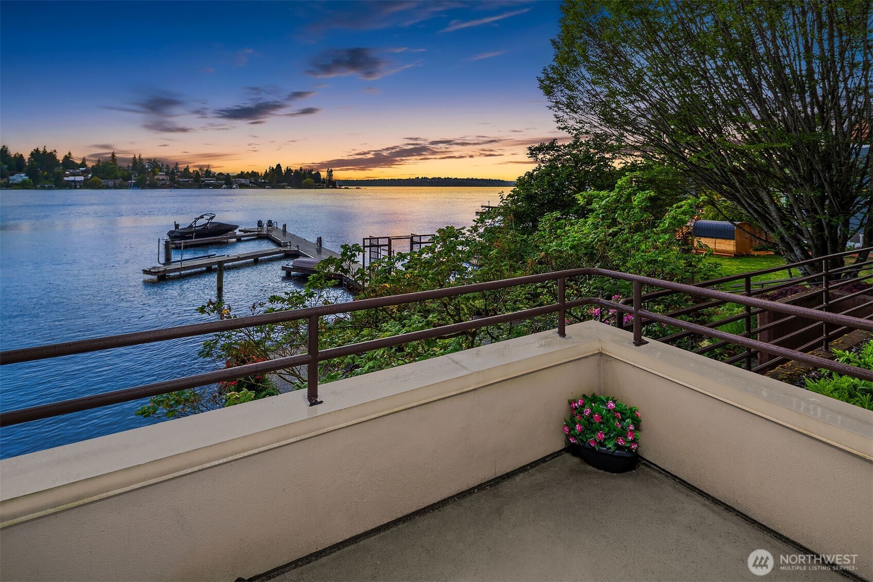 Step from the dining room onto an intimate uncovered 2nd deck that flows to the beautifully landscaped lawn and on to your private, gated dock. Morning coffee, evening sunsets, spontaneous afternoons on the water — it's all right here.