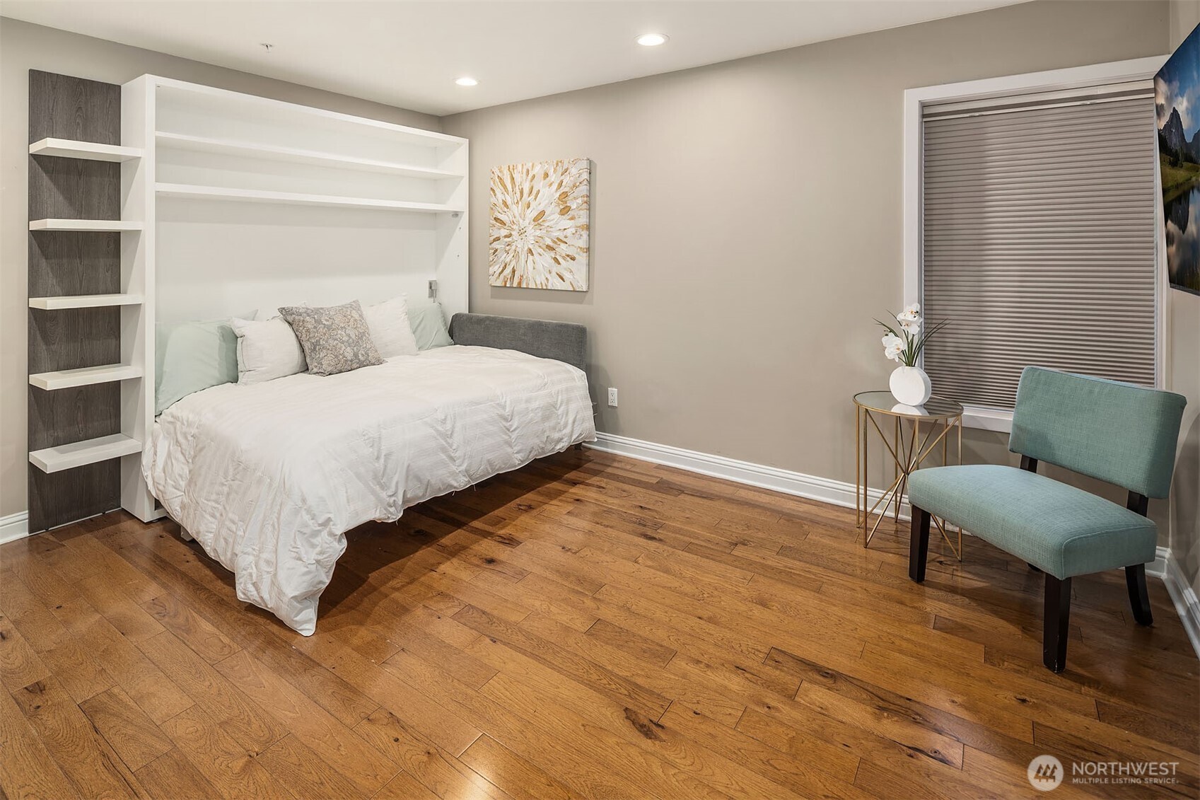 ersatility without compromise — the third bedroom features a custom Murphy bed with built-in shelving, an en-suite bath, and beautiful hardwood floors throughout. Guests get a private, comfortable retreat; when they leave, the room transforms into whatever you need it to be.