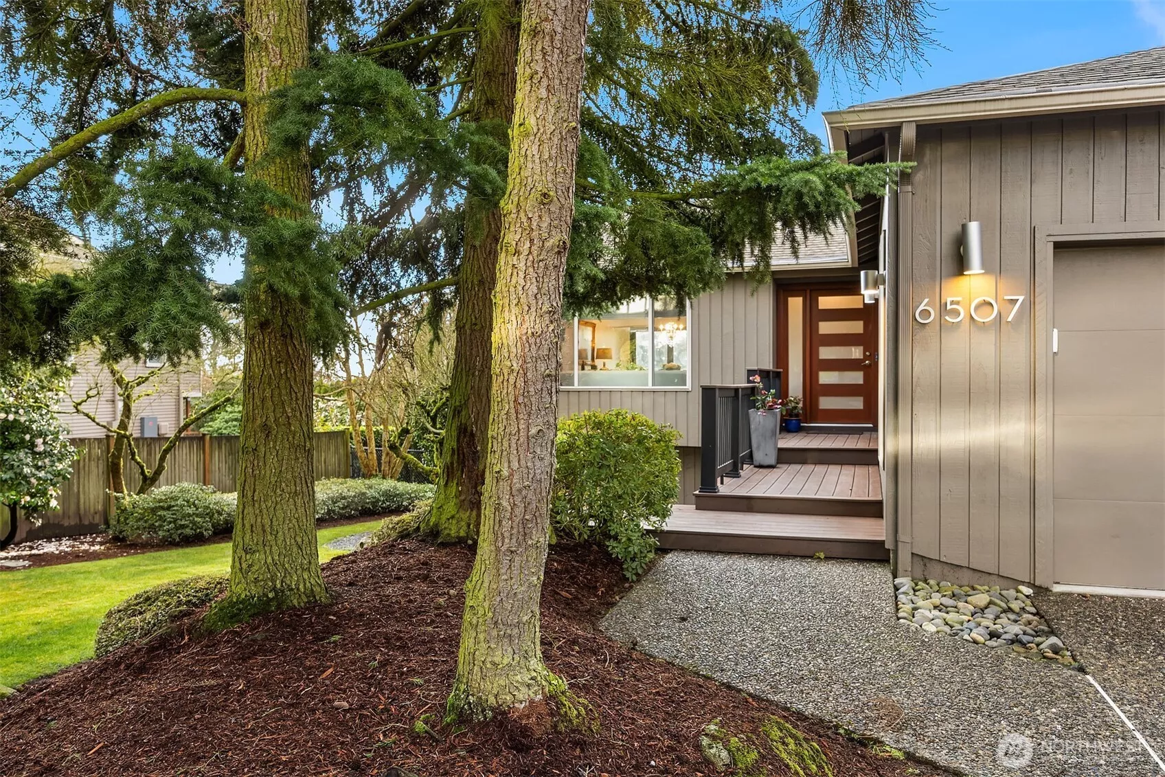 The professionally landscaped, nearly 12,000 sq ft lot showcases Camelias, Rhododendrons, Azaleas, Roses and a magnificent Magnolia tree in the back yard.