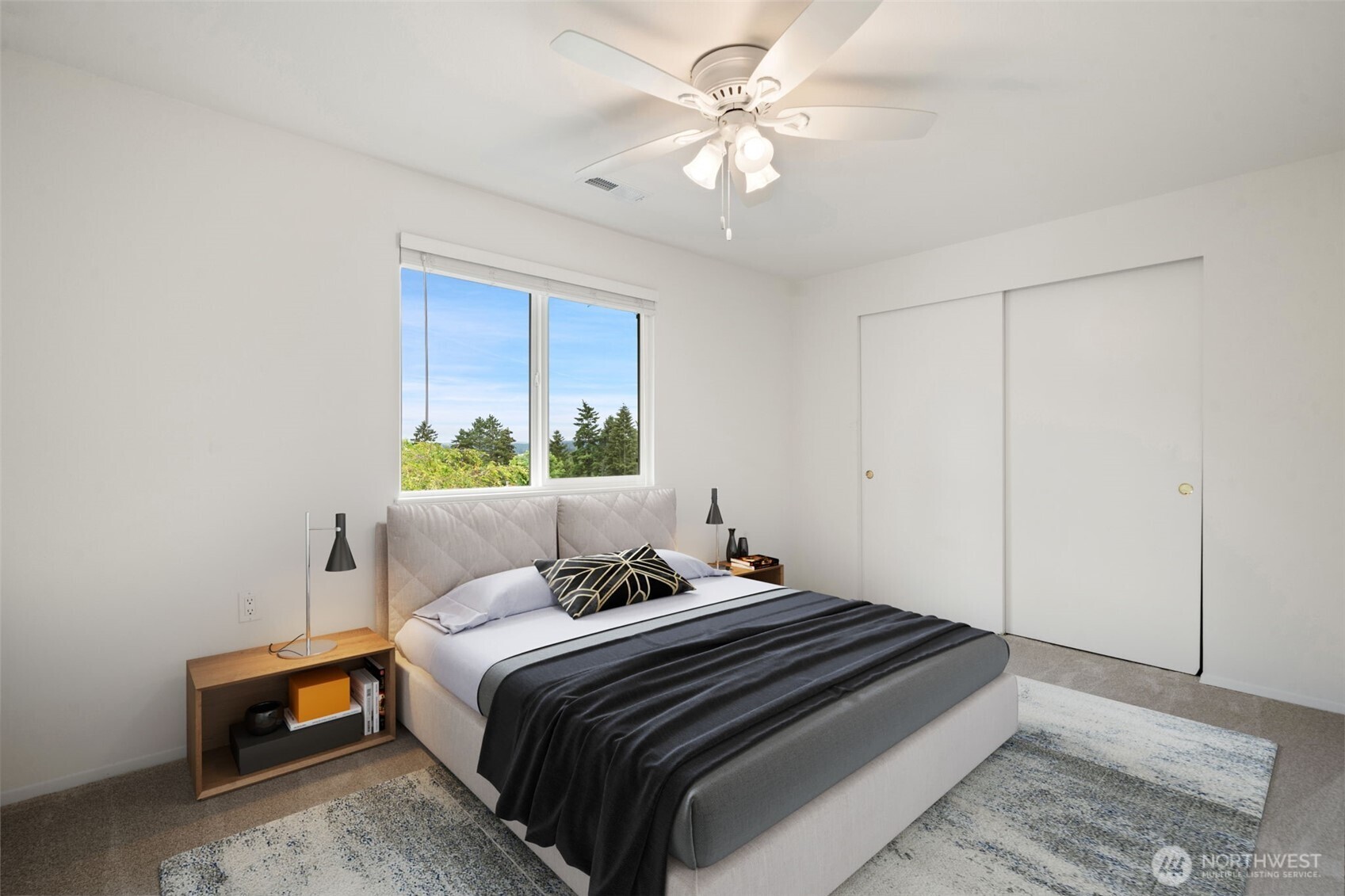 2nd level bedroom with fan and views of mountains - fresh carpets & paint. Virtually staged to show size & possibilities.