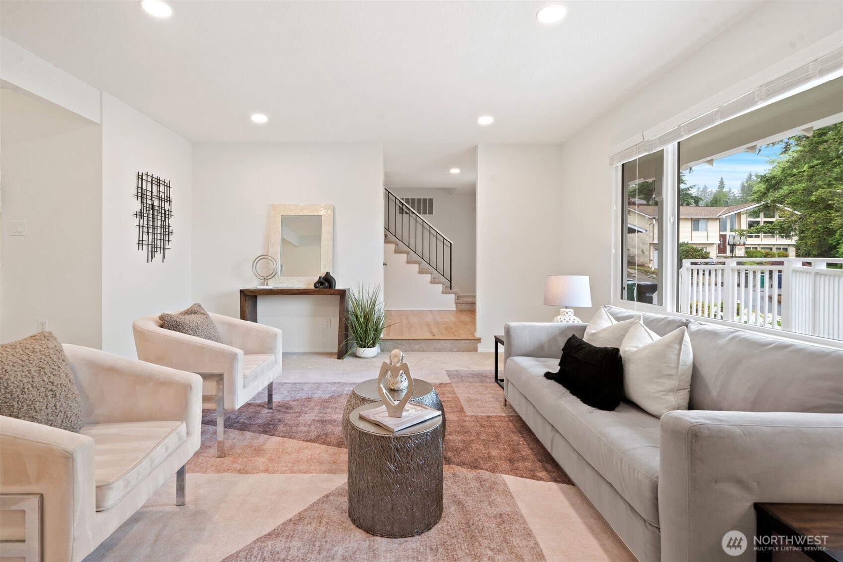 Generous living room with large windows to the mountains - new canned lighting, fresh paint & carpets