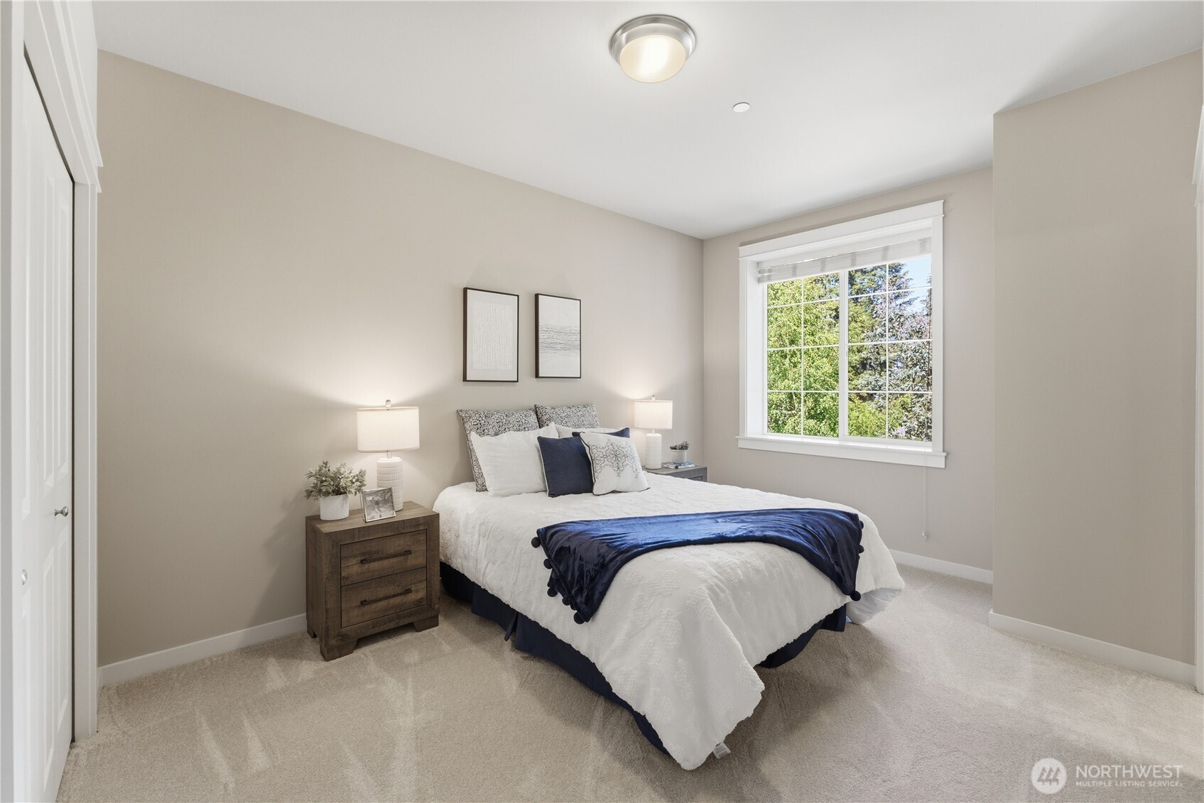 The second ensuite upstairs offers a bright, welcoming feel. The bathroom is just to the right (not shown), and both rooms are filled with gentle morning light