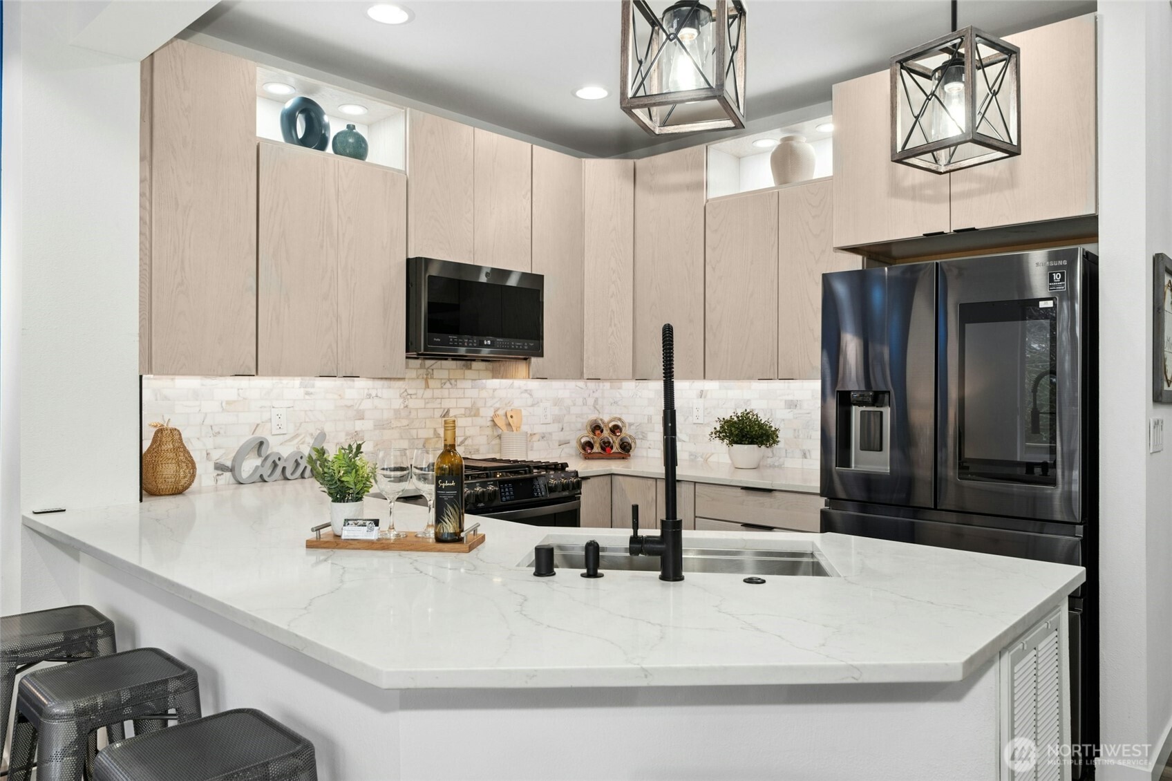Marble tile backsplash adds to the luxurious finish level.