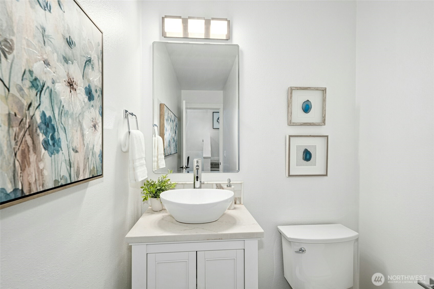 Main floor power bathroom with touchless faucet.