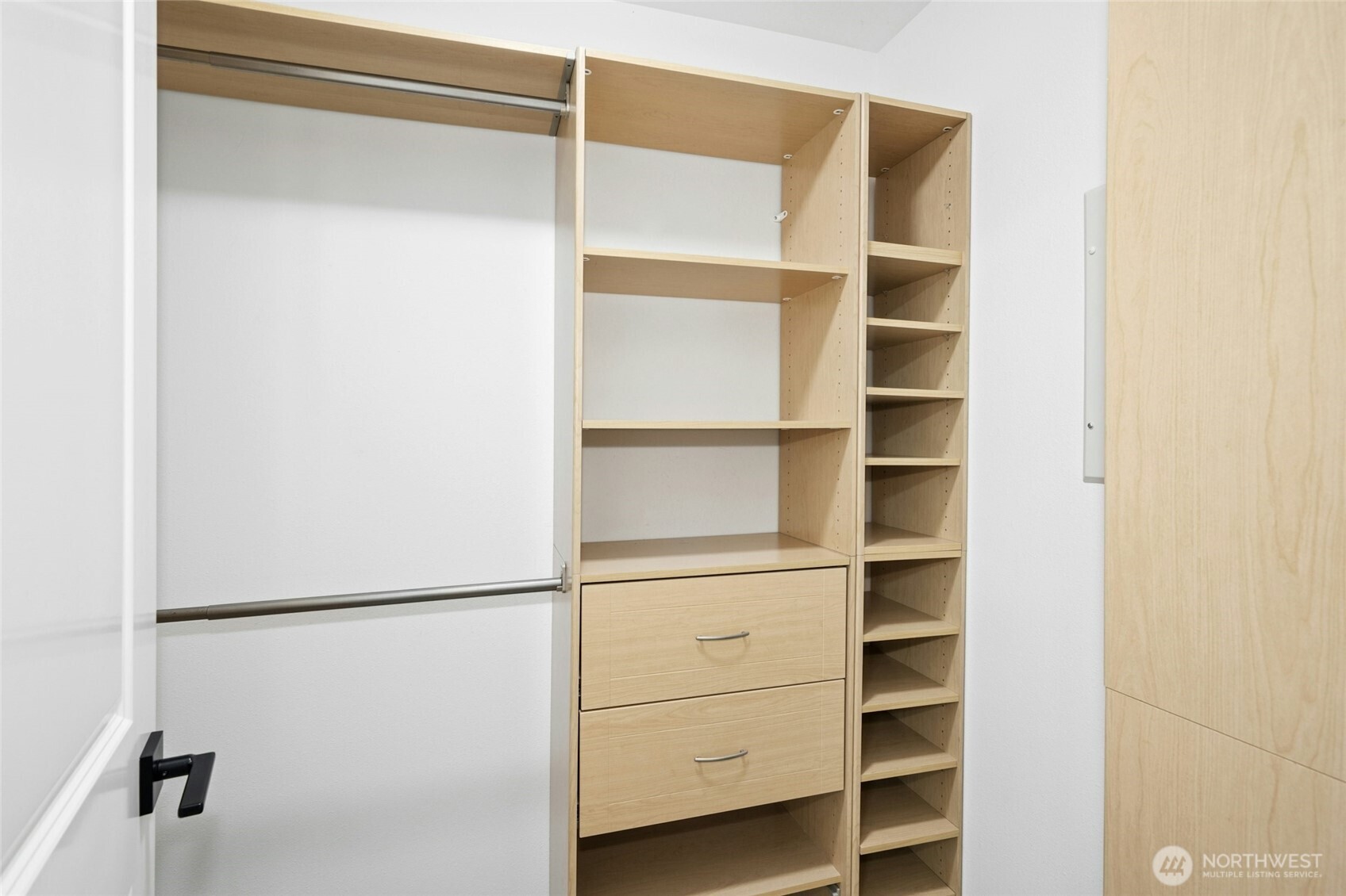 Walk-in primary closet has plenty of room for both!