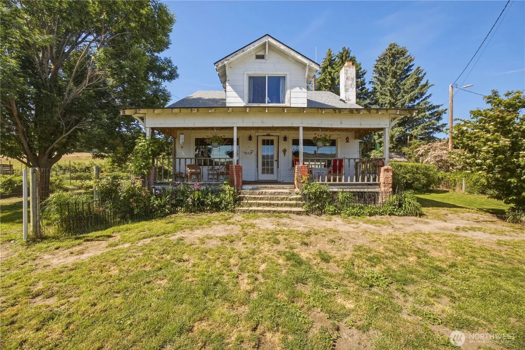 Charming Craftsman on 10+ acres with multiple outbuildings and another home.
