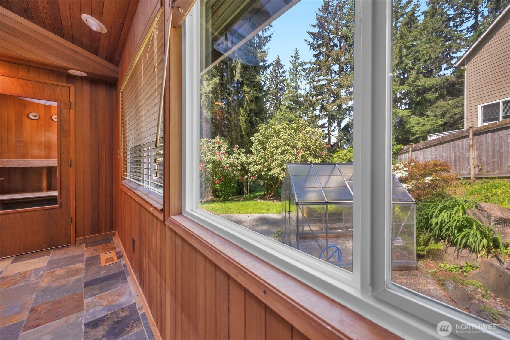 looking out of the window looking northwest.  You see the green house on the patio area.