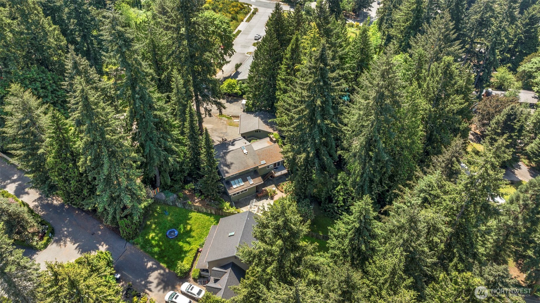 Looking down at the north side of the home. Patio area