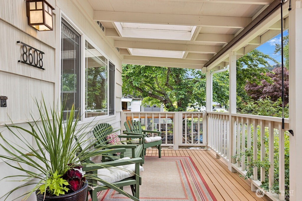 Stamped concrete walkways and lush gardens welcome you to this rambler on a dead end street.