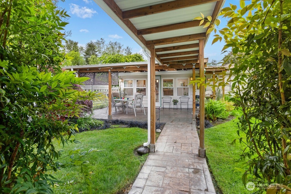 The breezeway leads to the additional outbuilding with heated studio, storage area and toolbench area