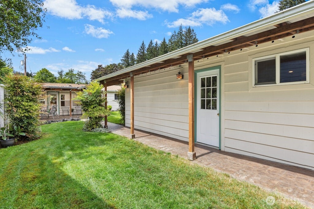 Side yard adjacent to the carport and back side of property