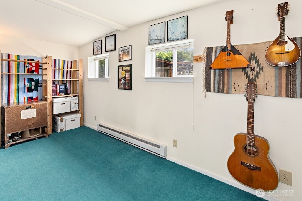 Storage areas and workshop area adjacent to back carport