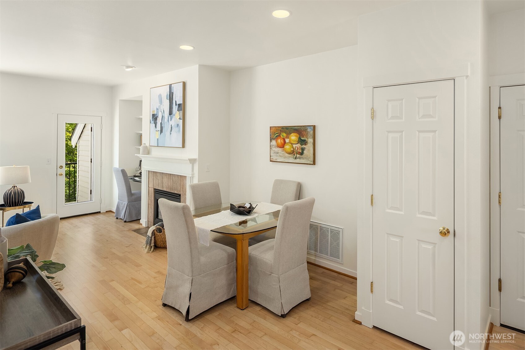 A closer look at the eating area, as well as the pantry and access door to the garage.