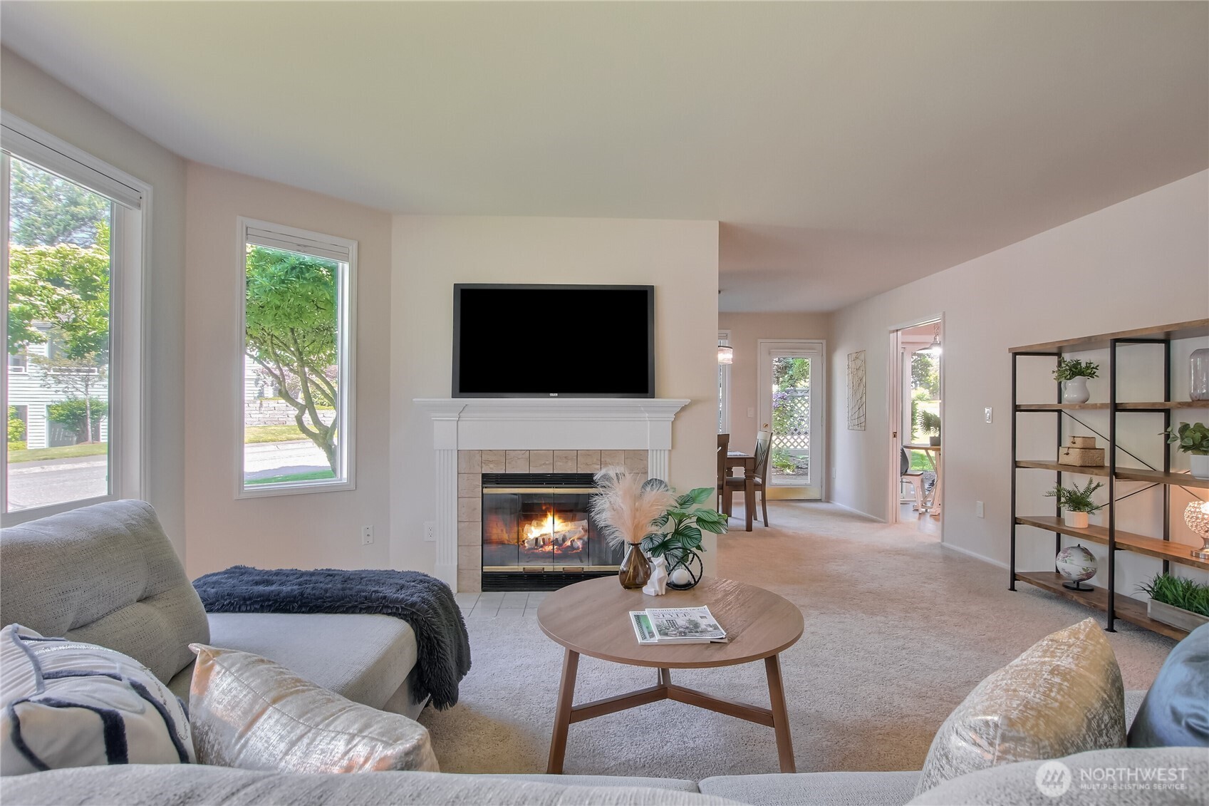 Cozy wood fireplace. Top-down blinds to take advantage of the tree/grass views.