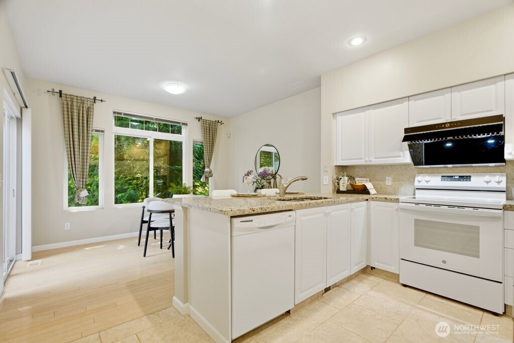 Eating space opens to nice secluded patio, this could be used as family room as well!