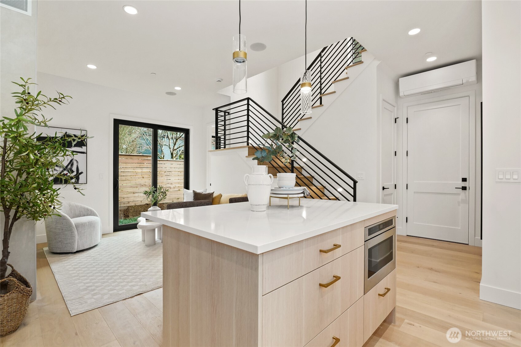 Open Staircase with Custom Metal Railings, Wide Plank Engineered Hardwood Floors, Broan HRV System and Heating/Cooling