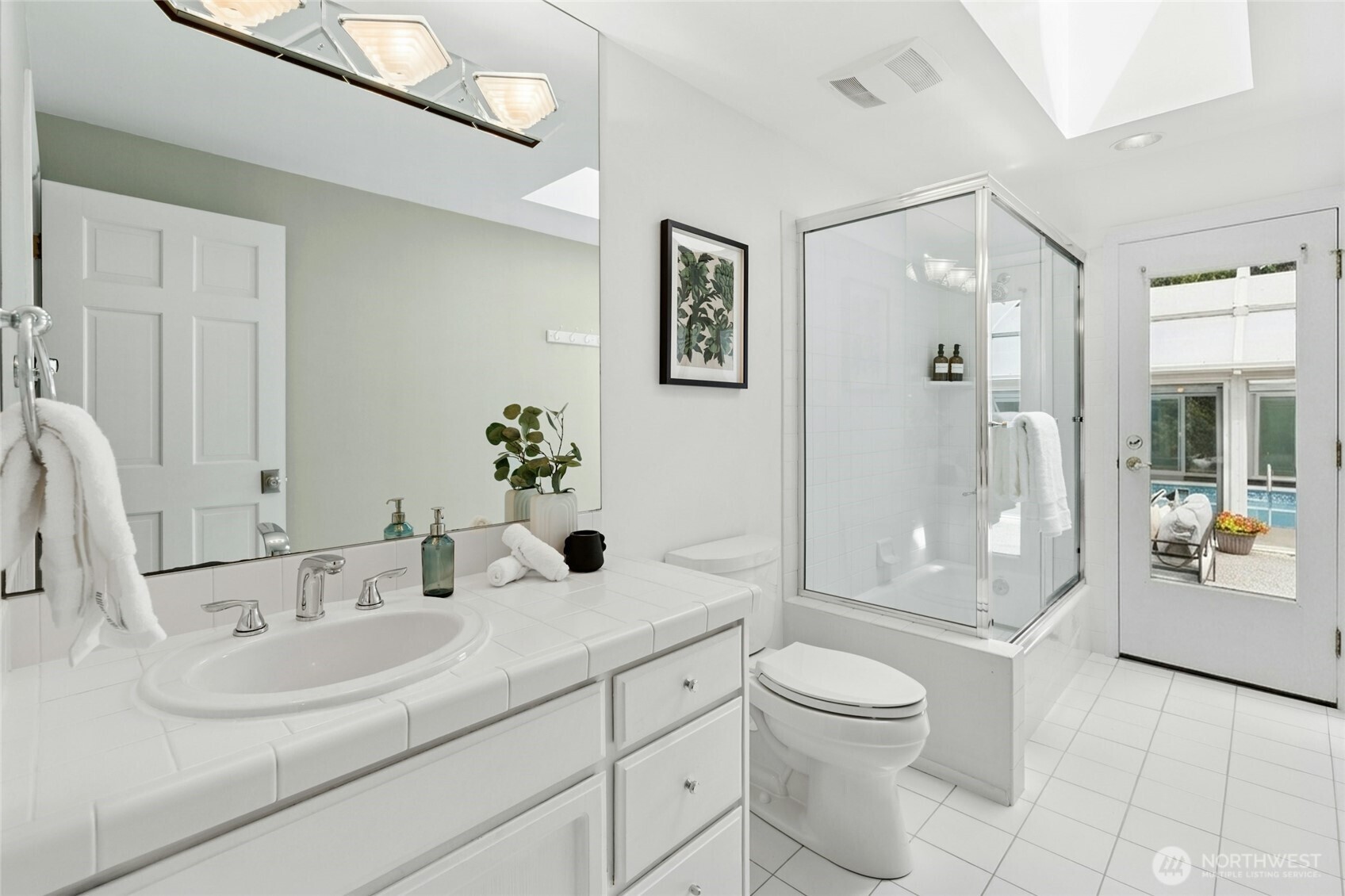 Shared hall bath. Opens to the courtyard so perfect for pool use.