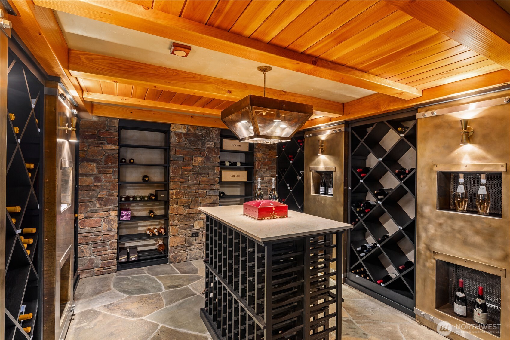 Conditioned wine room, with adjacent entry hall, craft room/storage, and concrete encased tunnels for commercial-level systems and construction.