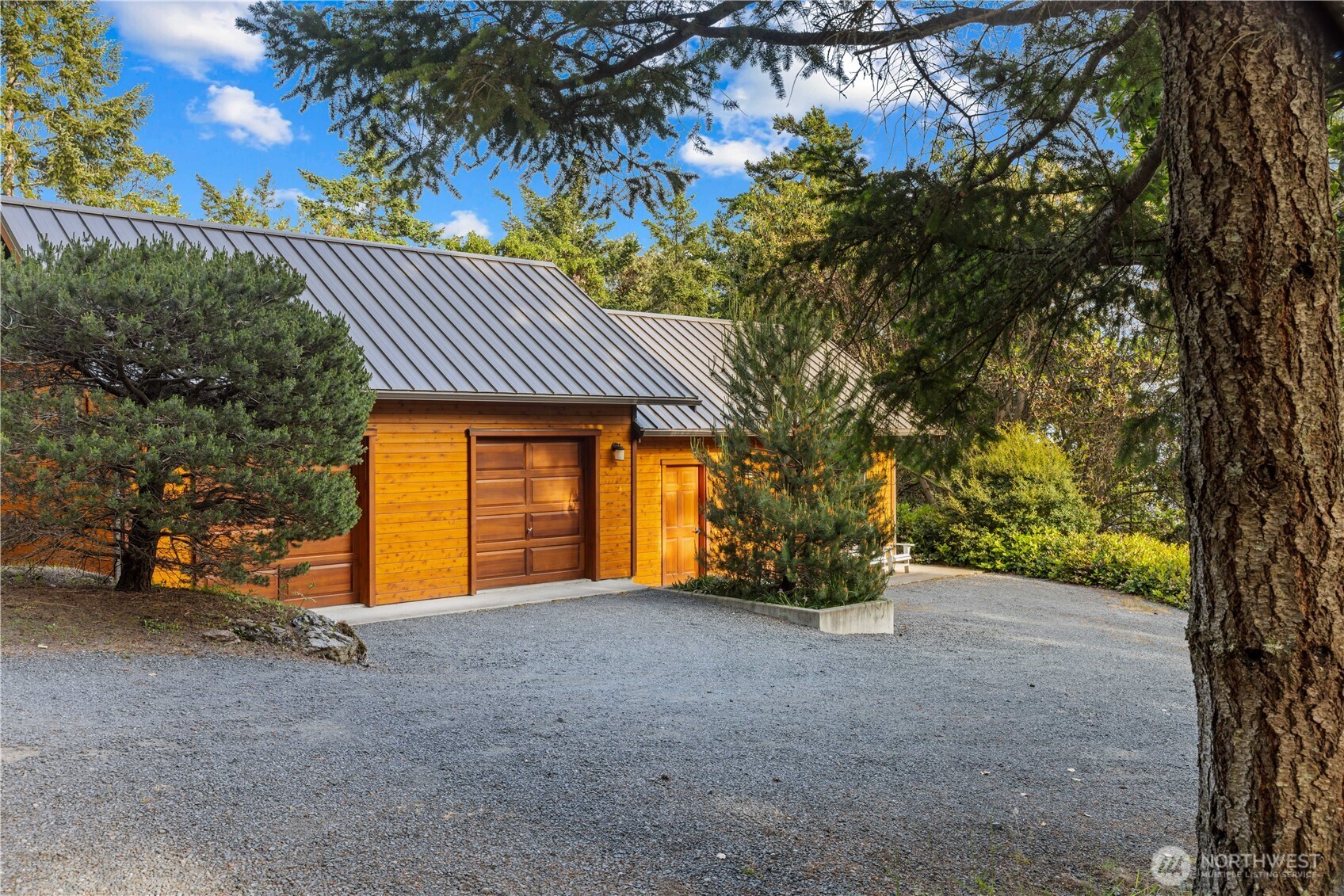 The detached maintenance facility and garage, on a separate tax parcel with a separate entrance gate.