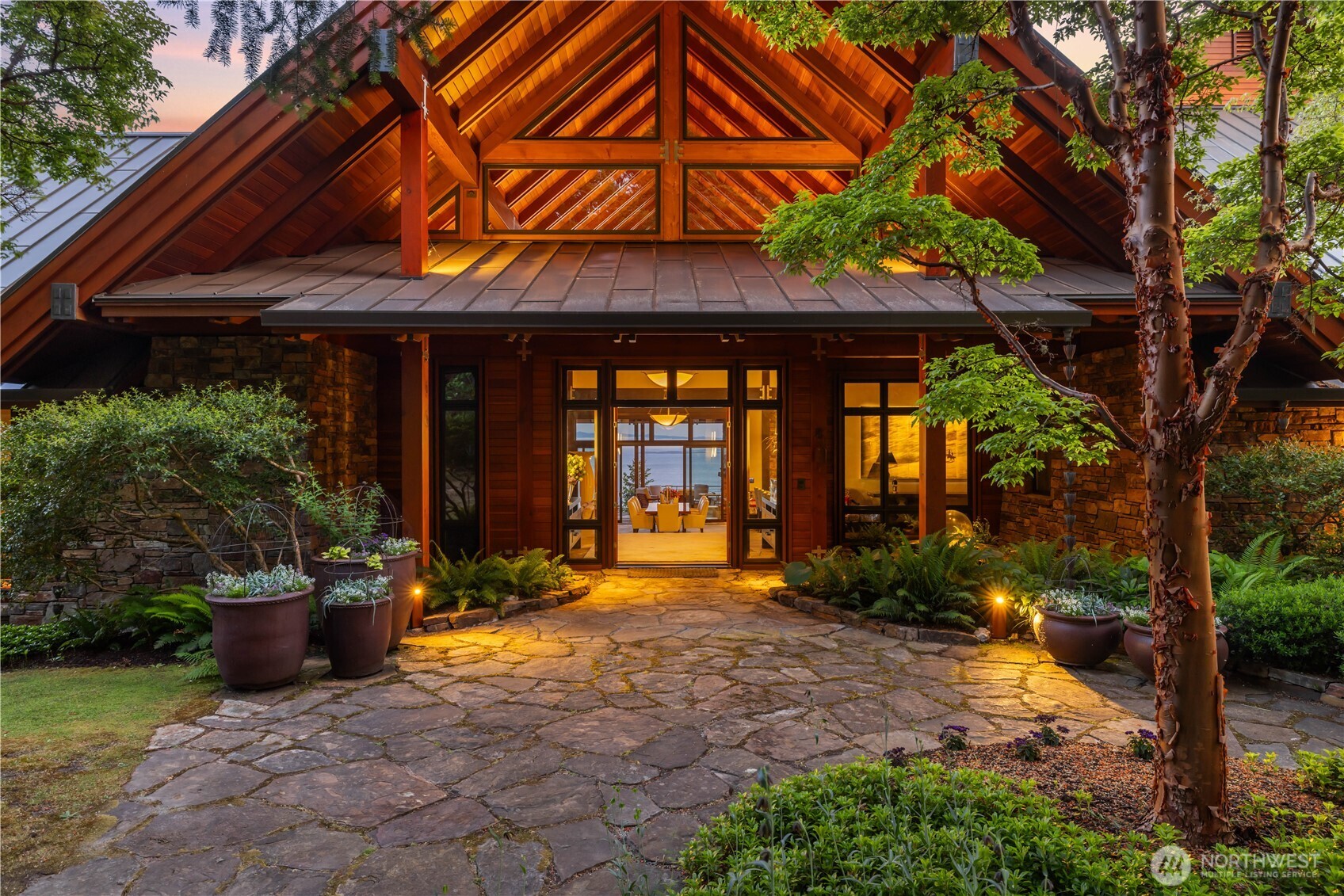 The resort-like entrance with magical pathways, lighting, and water features.